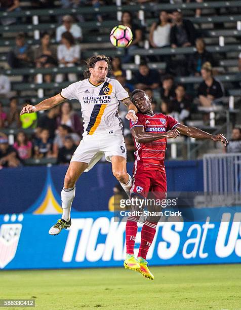 Alan Gordon of Los Angeles Galaxy heads the ball over Maynor Figueroa of FC Dallas during Los Angeles Galaxy's 2016 U.S Open Cup Semifinal match...