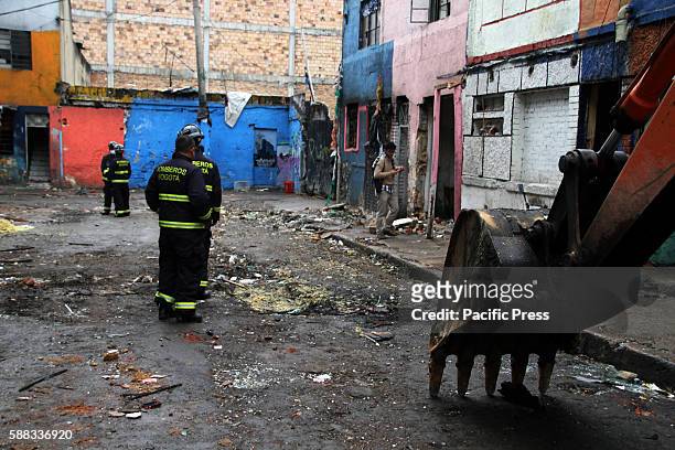 Members of the Fire Department of Bogotá during first day of demolition in "Calle del Bronx" , considered the most dangerous street in Bogota and one...