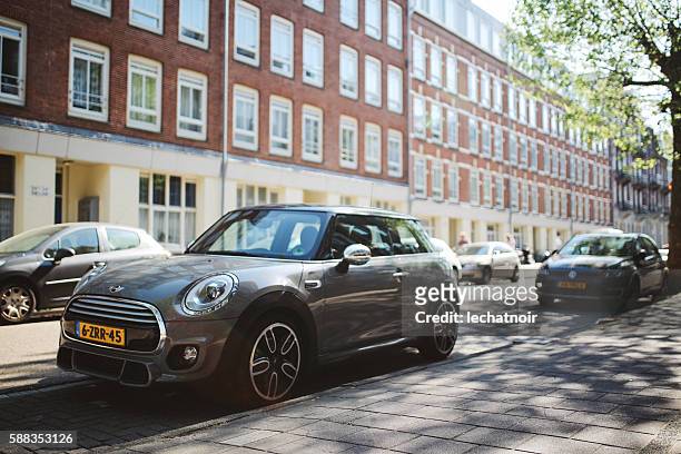 mini cooper in amsterdam - parked car stockfoto's en -beelden