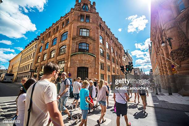 people crossing street in stockholm, sweden - södermalm stock pictures, royalty-free photos & images