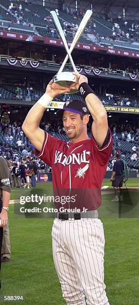 Luis Gonzalez of the Arizona Diamondbacks holds the winner's trophy for the All-Star Home Run Derby at Safeco Field in Seattle Washington. <DIGITAL...