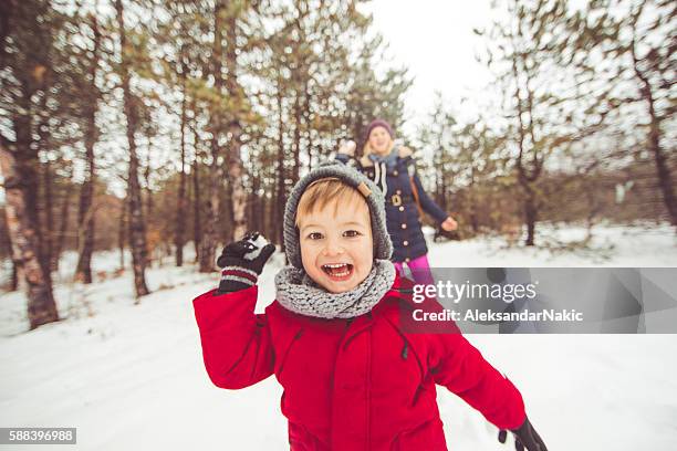 snowballing - winter hat stock pictures, royalty-free photos & images