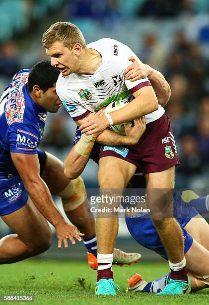 Tom Trbojevic of the Eagles is tackled during the round 23 NRL match between the Canterbury Bulldogs and the Manly Sea Eagles at ANZ Stadium on...