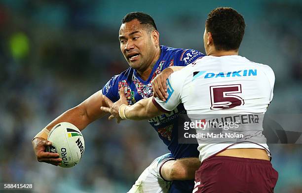 Tony Williams of the Bulldogs runs the ball during the round 23 NRL match between the Canterbury Bulldogs and the Manly Sea Eagles at ANZ Stadium on...