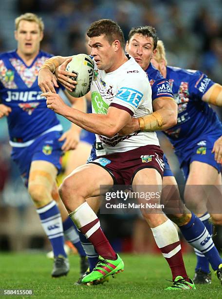 Darcy Lussick of the Eagles runs the ball during the round 23 NRL match between the Canterbury Bulldogs and the Manly Sea Eagles at ANZ Stadium on...