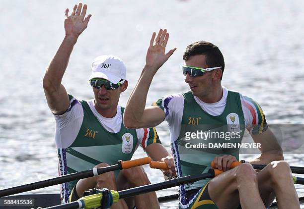 South Africa's James Thompson and South Africa's John Smith wave during the LWT Men's Double Sculls semifinal rowing competition at the Lagoa stadium...