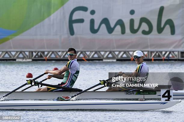 South Africa's James Thompson and South Africa's John Smith row during the LWT Men's Double Sculls semifinal rowing competition at the Lagoa stadium...