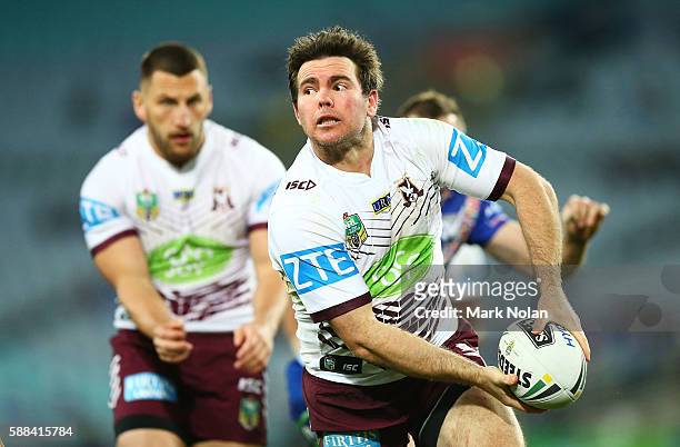 Jamie Lyon of the Eagles looks for support during the round 23 NRL match between the Canterbury Bulldogs and the Manly Sea Eagles at ANZ Stadium on...