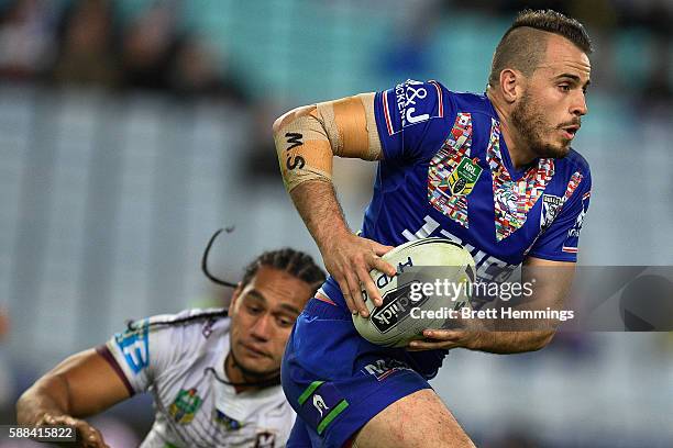 Josh Reynolds of the Bulldogs runs the ball during the round 23 NRL match between the Canterbury Bulldogs and the Manly Sea Eagles at ANZ Stadium on...