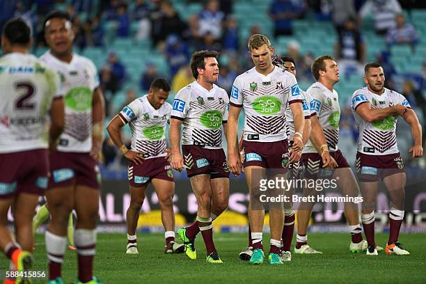 Manly players show their dejection during the round 23 NRL match between the Canterbury Bulldogs and the Manly Sea Eagles at ANZ Stadium on August...