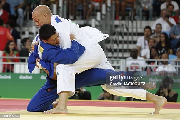 Netherlands' Henk Grol competes with Canada's Kyle Reyes during their men's -100kg judo contest match of the Rio 2016 Olympic Games in Rio de Janeiro...