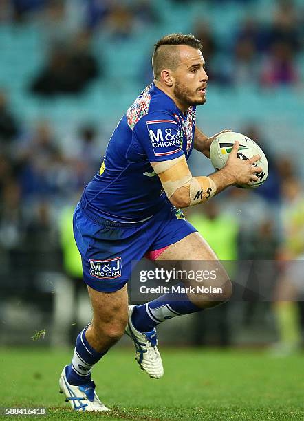 Josh Reynolds of the Bulldogs runs the ball during the round 23 NRL match between the Canterbury Bulldogs and the Manly Sea Eagles at ANZ Stadium on...