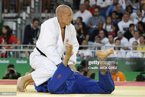 Netherlands' Henk Grol competes with Canada's Kyle Reyes during their men's -100kg judo contest match of the Rio 2016 Olympic Games in Rio de Janeiro...