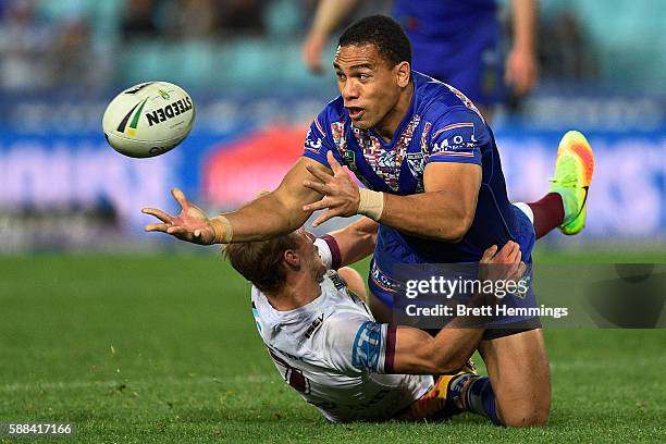 William Hopoate of the Bulldogs off loads the ball during the round 23 NRL match between the Canterbury Bulldogs and the Manly Sea Eagles at ANZ...