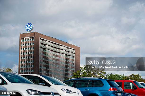 Wolfsburg, Germany Office Builiding of Volkswagen AG headquarters seen behind VW employees car park on August 09, 2016 in Wolfsburg, Germany.