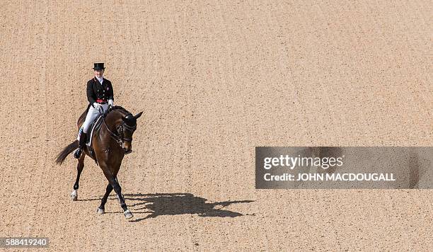 Canada's Belinda Trussel on Anton performs her routine during the Equestrian's Dressage Grand Prix event of the 2016 Rio Olympic Games at the Olympic...