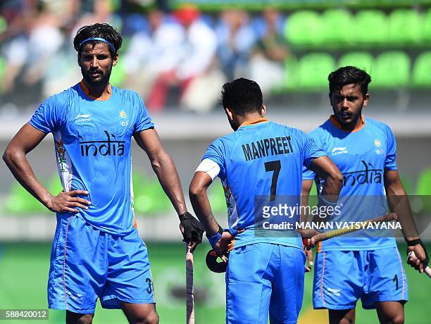 India's Rupinder Pal Singh looks on during the men's field hockey Netherland's vs India match of the Rio 2016 Olympics Games at the Olympic Hockey...