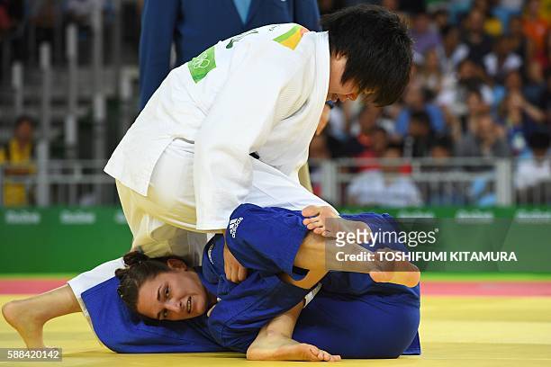 Japan's Mami Umeki competes with Hungary's Abigel Joo during their women's -78kg judo contest match of the Rio 2016 Olympic Games in Rio de Janeiro...