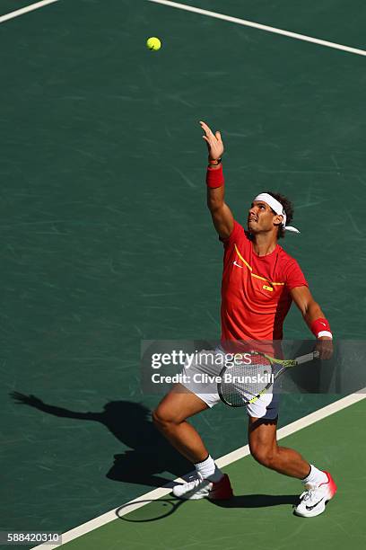 Rafael Nadal of Spain serves during the men's singles third round match against Gilles Simon of France on Day 6 of the 2016 Rio Olympicsjat the...