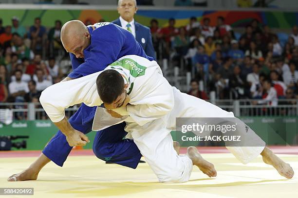 France's Cyrille Maret competes with Netherlands' Henk Grol during their men's -100kg judo contest match of the Rio 2016 Olympic Games in Rio de...