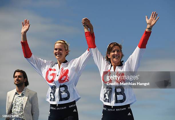 Victoria Thornley of Great Britain and Katherine Grainger of Great Britain celebrate with their silver medals after finishing second in the Women's...