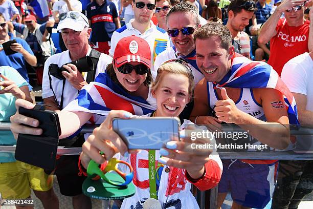 Victoria Thornley of Great Britain celebrates with supporters after winning silver with Katherine Grainger in the Women's Double Sculls Final A on...