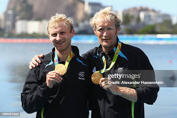 Hamish Bond and Eric Murray of New Zealand pose after winning the gold medal in the Men's Pair Final A on Day 6 of the Rio 2016 Olympic Games at the...