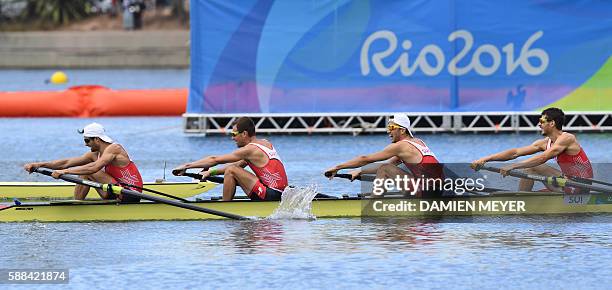 Switzerland's Mario Gyr, Switzerland's Simon Niepmann, Switzerland's Simon Schuerch and Switzerland's Lucas Tramer row during the LWT Men's Four...