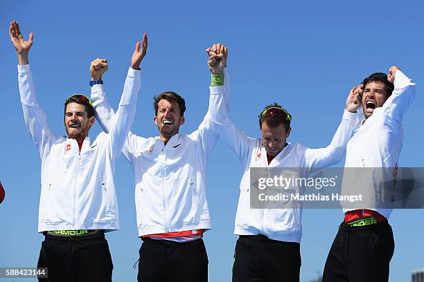 Lucas Tramer of Switzerland, Simon Schuerch of Switzerland, Simon Niepmann of Switzerland and Mario Gyr of Switzerland celebrate winning gold in the...