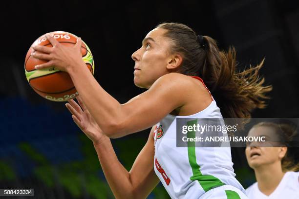 Belarus' shooting guard Tatsiana Likhtarovich goes to the basket next to Turkey's point guard Birsel Vardarli Demirmen during a Women's round Group A...