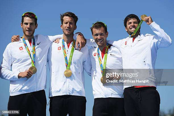 Lucas Tramer of Switzerland, Simon Schuerch of Switzerland, Simon Niepmann of Switzerland and Mario Gyr of Switzerland celebrate winning gold in the...