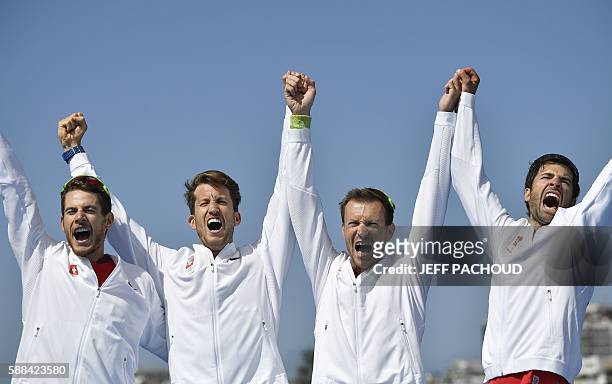 Switzerland's Lucas Tramer, Switzerland's Simon Schuerch, Switzerland's Simon Niepmann and Switzerland's Mario Gyr celebrate on the podium of LWT...