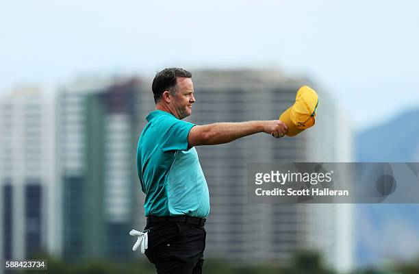 Marcus Fraser of Australia reacts after finishing on the 18th green during the first round of men's golf on Day 6 of the Rio 2016 Olympics at the...