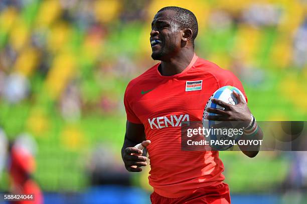 Kenya's Willie Ambaka runs with the ball in the mens rugby sevens match between Brazil and Kenya during the Rio 2016 Olympic Games at Deodoro Stadium...