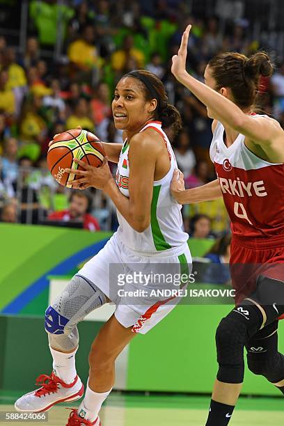 Belarus' guard Lindsey Harding works around Turkey's point guard Olcay Cakir during a Women's round Group A basketball match between Belarus and...