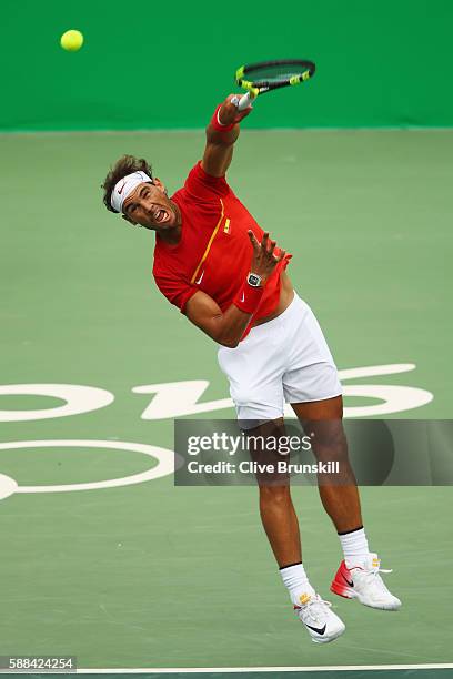 Rafael Nadal of Spain serves during the men's singles third round match against Gilles Simon of France on Day 6 of the 2016 Rio Olympics at the...