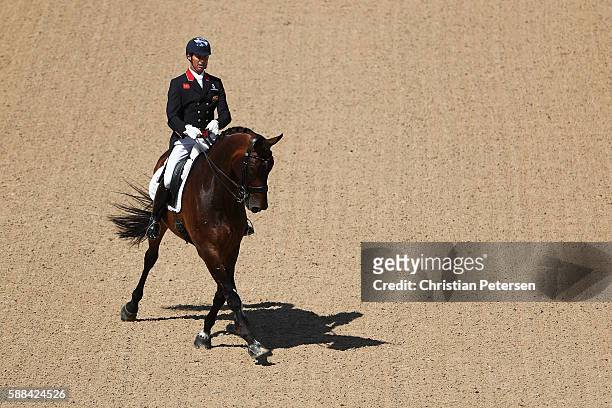 Carl Hester of Great Britain riding Nip Tuck competes in the Mens/Womens Team Dressage Grand Prix event on Day 6 of the Rio 2016 Olympic Games at the...