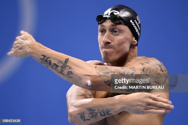 France's Frederick Bousquet warms up before competing in a Men's 50m Freestyle heat during the swimming event at the Rio 2016 Olympic Games at the...
