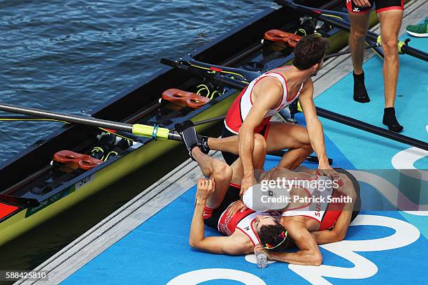 Lucas Tramer of Switzerland, Simon Schuerch of Switzerland, Simon Niepmann of Switzerland and Mario Gyr of Switzerland celebrate winning in the...