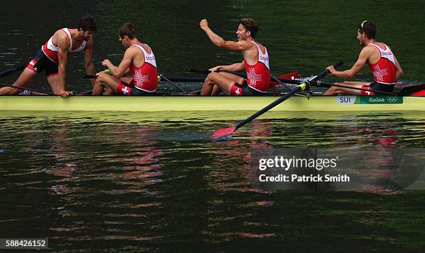 Mario Gyr, Simon Niepmann, Simon Schuerch, and Lucas Tramer of Switzerland celebrate after winning the gold medal in the Lightweight Men's Four Final...