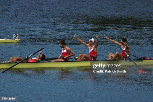 Mario Gyr, Simon Niepmann, Simon Schuerch, and Lucas Tramer of Switzerland celebrate after winning the gold medal in the Lightweight Men's Four Final...