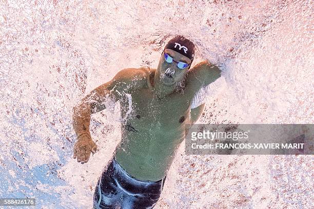 France's Florent Manaudou competes in a Men's 50m Freestyle heat during the swimming event at the Rio 2016 Olympic Games at the Olympic Aquatics...