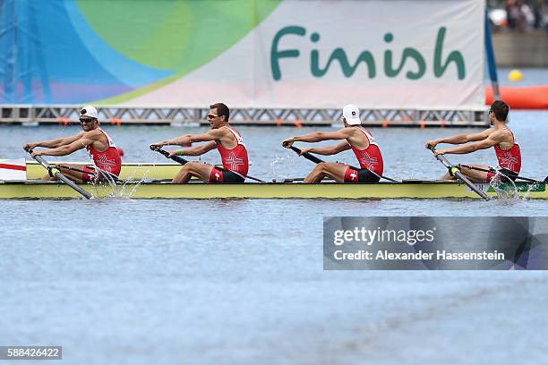 Mario Gyr, Simon Niepmann, Simon Schuerch, and Lucas Tramer of Switzerland compete in the Lightweight Men's Four Final A on Day 6 of the Rio 2016...