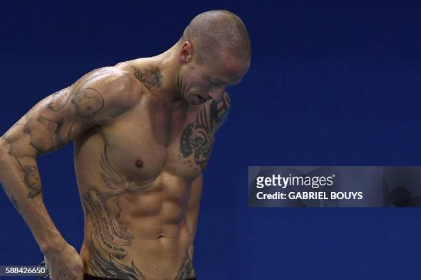 France's Frederick Bousquet reacts after competing in a Men's 50m Freestyle heat during the swimming event at the Rio 2016 Olympic Games at the...