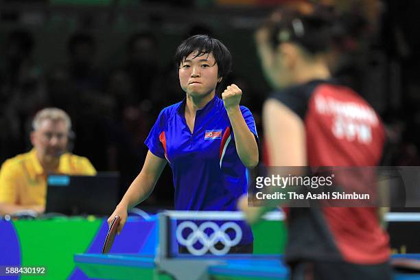 Song I Kim of North Korea celebrates a point during her Women's Table Tennis Bronze Medal match against Ai Fukuhara of Japan at Rio Centro on August...