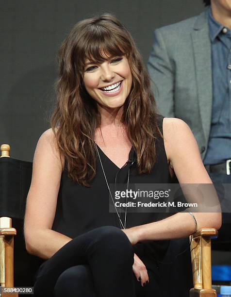 Actress Devin Kelley speaks onstage at the 'Frequency' panel discussion during The CW portion of the 2016 Television Critics Association Summer Tour...