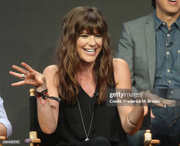 Actress Devin Kelley speaks onstage at the 'Frequency' panel discussion during The CW portion of the 2016 Television Critics Association Summer Tour...