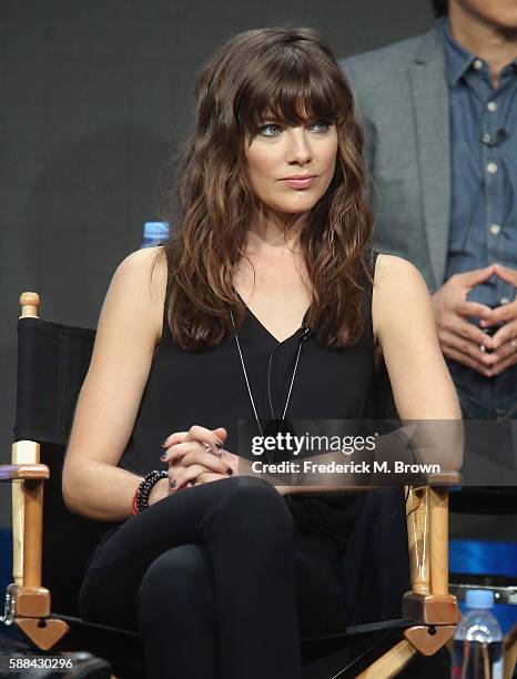 Actress Devin Kelley speaks onstage at the 'Frequency' panel discussion during The CW portion of the 2016 Television Critics Association Summer Tour...