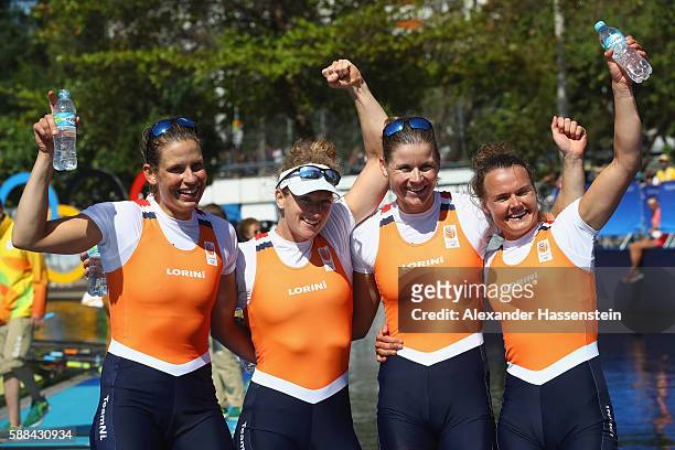 Chantal Achterberg, Nicole Beukers, Inge Janssen, and Carline Bouw of the Netherlands pose after winning the silver medal in the Women's Quadruple...