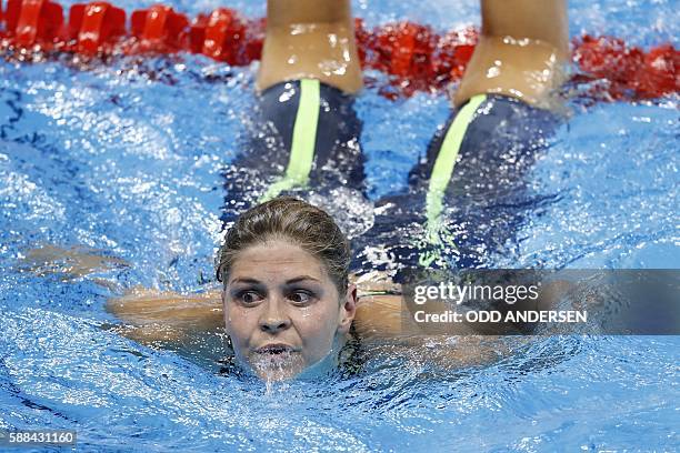 Denmark's Lotte Friis looks on after competing in a Women's 800m Freestyle heat during the swimming event at the Rio 2016 Olympic Games at the...